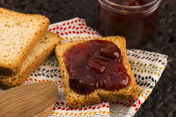 Breakfast of cherry jam on toast