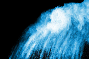 Freeze motion of colored powder explosion isolated on black background.