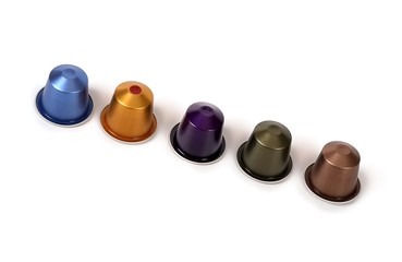 Multi-colored capsules with strong coffee in various angles on a white background