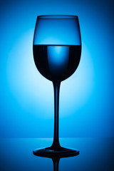 glass of   water at blue background