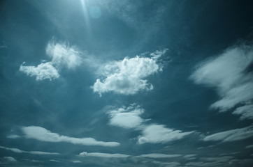 Naklejka na ściany i meble Saturated clouds in the blue sky