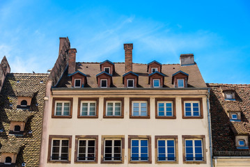 Fototapeta na wymiar Detail of a building in the city centre of Strasbourg against blue sky