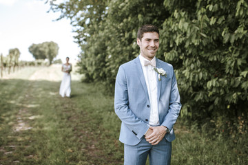 groom waiting for brides first look