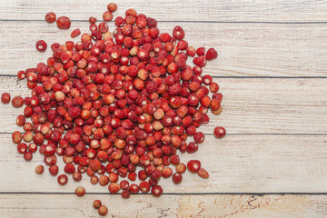 Heap of fresh strawberries on the wooden table