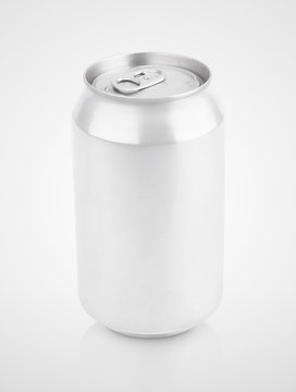 Closed 330 ml aluminum beverage drink soda can on gray background with clipping path