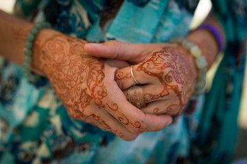 Henna painted hand of a female devotee