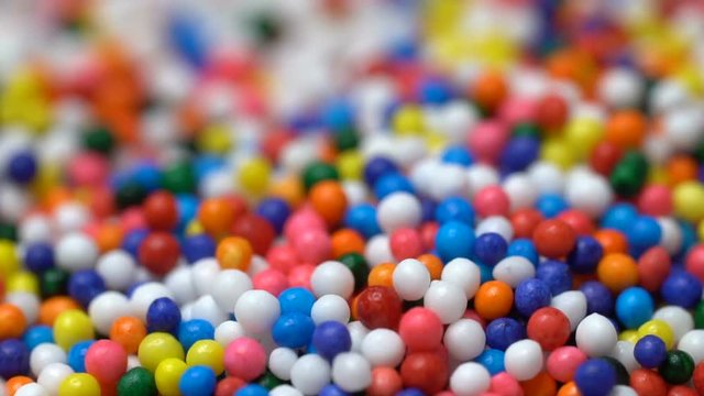 Colorful sprinkles sugar candy pouring down