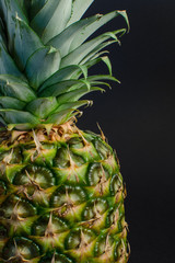 pineapple fruit closeup on black background, closeup - 162773116