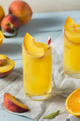 Fototapeta na wymiar Refreshing Peach and Orange Fuzzy Navel Cocktail