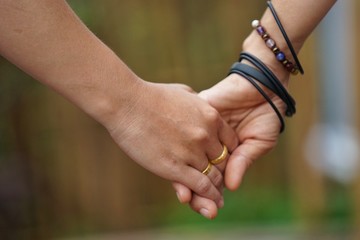 Two women walked hand in hand to each other as a special bond of two people.