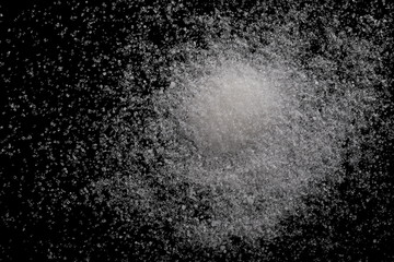 White sugar closeup isolated on black background and texture, top view