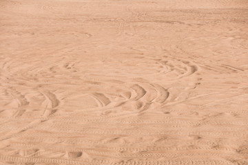 car trace on sand desert