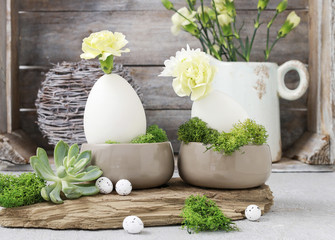 Obraz na płótnie Canvas Floral arrangement with goose egg, carnations, chrysanthemum and moss.