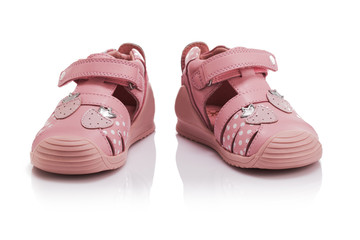 Orthopedic leather baby girl summer sandals isolated on white