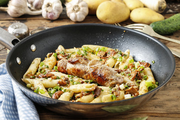 Baked pork chop with penne pasta