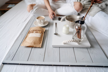 Woman eating cereals in bed
