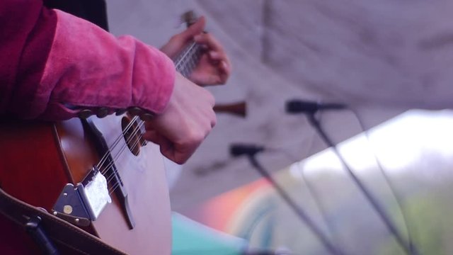 a Married Bard Performs on a Small Stage