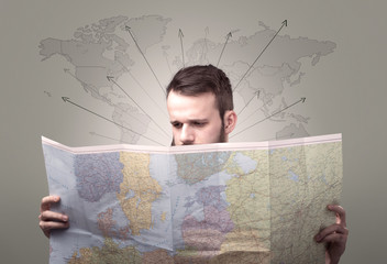 Young man holding map