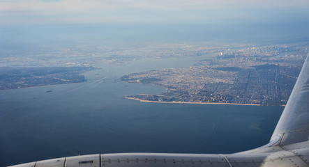 New York - The Big Apple from above / New York City, Manhattan, lower Bay and brighton beach from an airplane / Landing at JFK