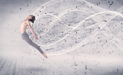 Performance ballet dancer jumping with energy explosion particles