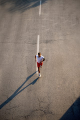 Athlete running on the road.