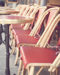Fototapeta na wymiar Chairs and tables of an outdoors cafe in Paris
