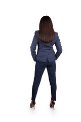 Confident and stylish woman businesswoman in a business suit, rear view. In the studio on a white background