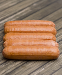 Hot Dogs Isolated on a Wooden Table
