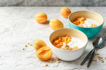 Homemade yogurt with granola, apricot and pine nuts