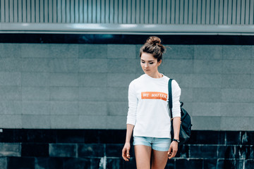 Beautiful young girl posing on metro station