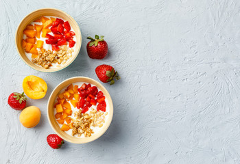 Homemade yogurt with granola, apricot and pine nuts