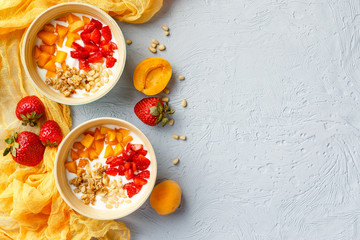 Homemade yogurt with granola, apricot and pine nuts