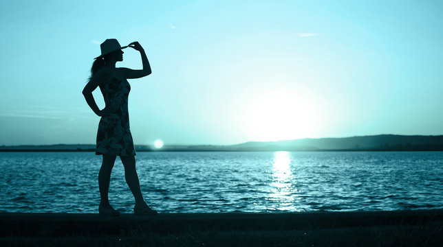 Enjoying life concept -  website banner of a woman as standing on the beach