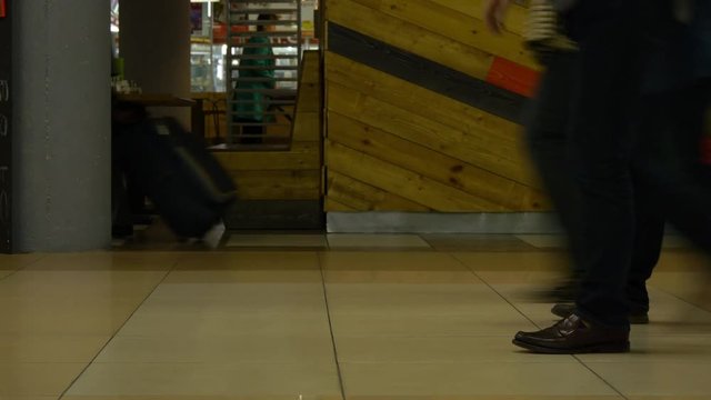 Passengers With Luggage Walking In Airport Terminal