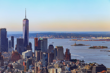 Naklejka premium New York City south view at sunrise with morning mist