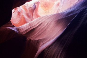 Obraz premium Nature red sandstone textured background. Swirls of old red sandstone wall abstract pattern in Upper Antelope Canyon, Page, Arizona, USA.