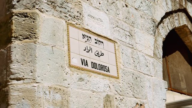 Via Dolorosa street sign in Jerusalem old city. Via Dolorosa is a sacred place for the all Christians in the world. Located in Holy land Jerusalem. Zoom shot.