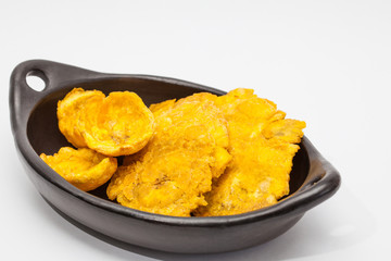 Plantain cups and patacones on white background