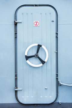 Battleship iron door with steering wheel lock background