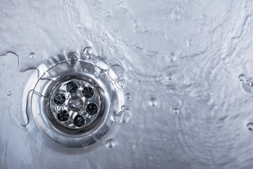 sink, drain and flowing water for background