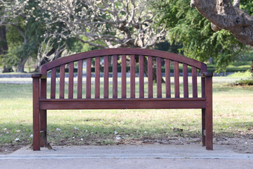 Empty wooden chair or old wood bench in the garden.