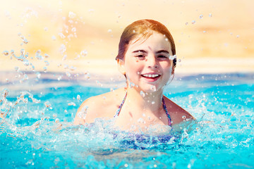 Happy girl in the pool