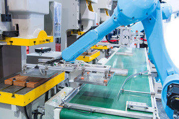 Industrial robot with conveyor in manufacture factory,Smart factory industry 4.0 concept.