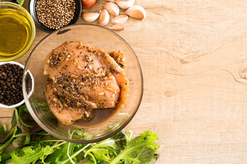 fresh raw chicken with condiment