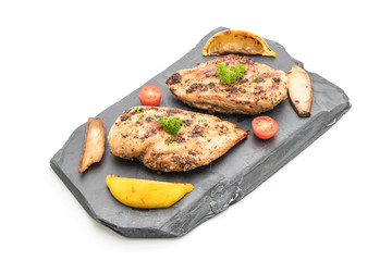 Grilled chicken fillets on slate plate