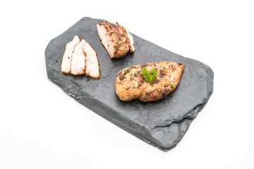 Grilled chicken fillets on slate plate