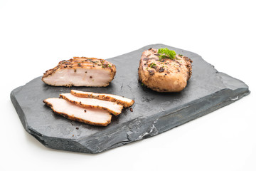 Grilled chicken fillets on slate plate