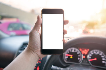 man holding mobile phone with blank space in the car
