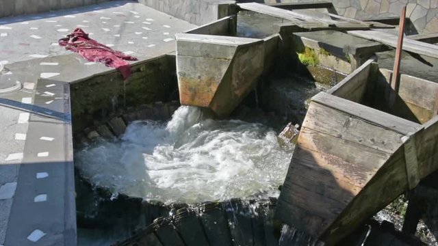 A traditional carpet washing machine in a river in the Maramures region