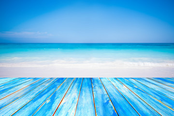 Blue wooden table top on blurred beach background